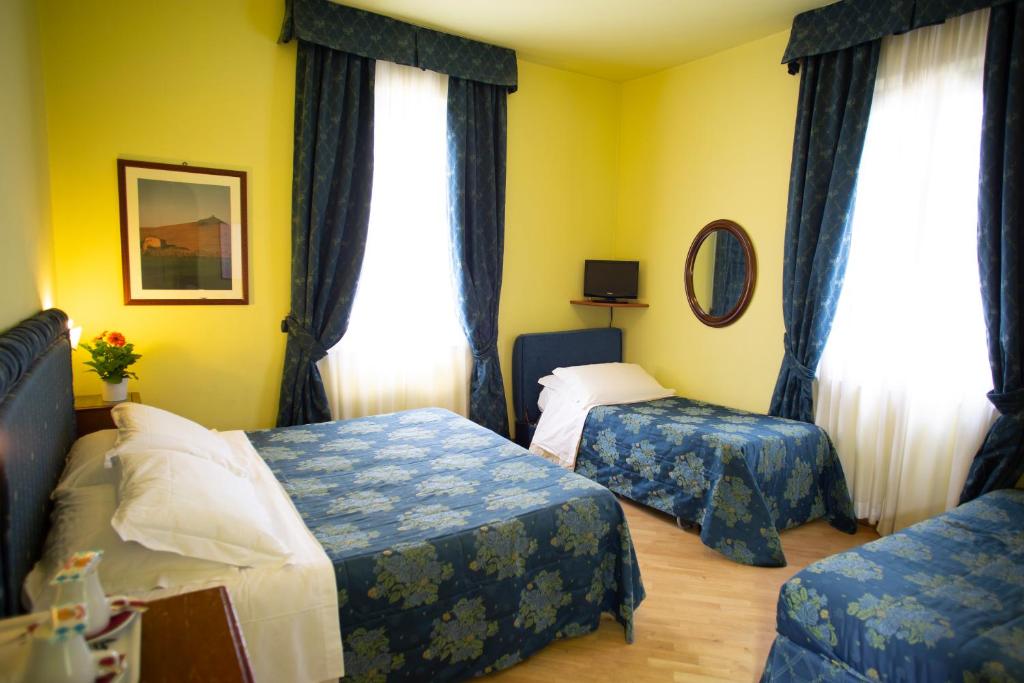 Postel nebo postele na pokoji v ubytování Hotel Ristorante Piccolo Chianti