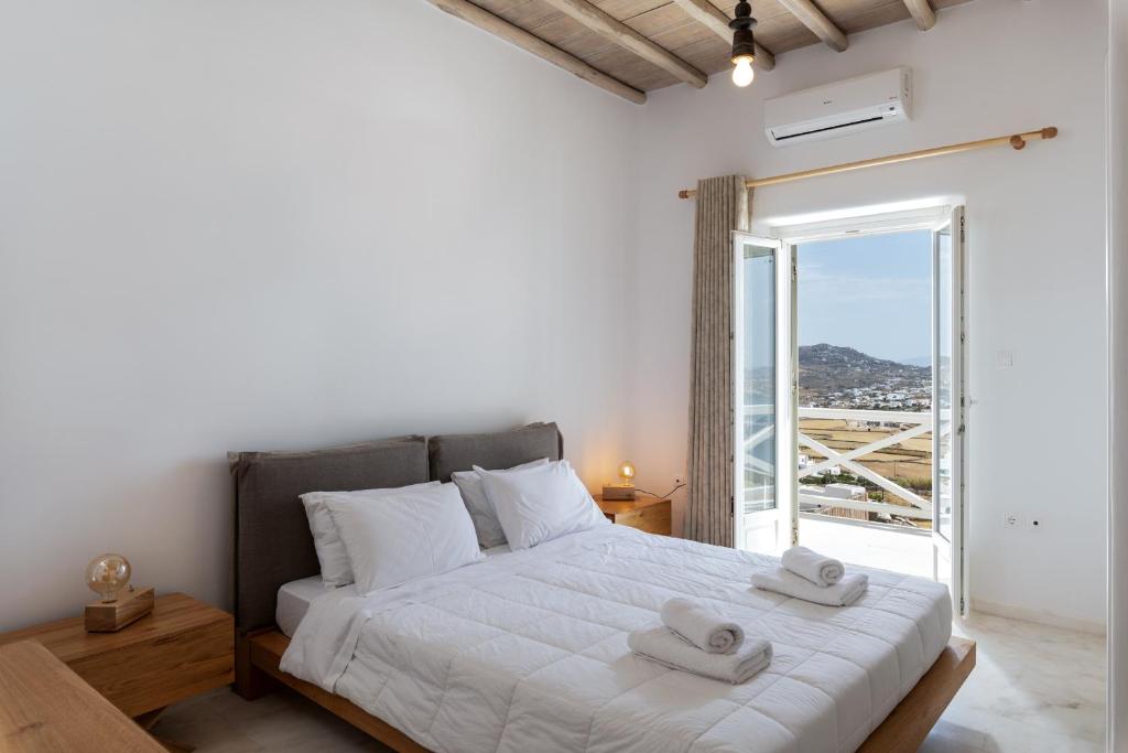 Postel nebo postele na pokoji v ubytování Mykonos Divino