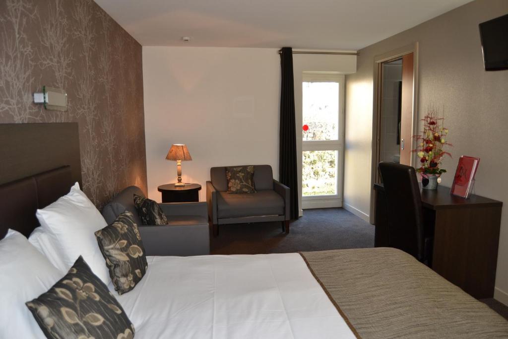 Postel nebo postele na pokoji v ubytování Hotel Reine Mathilde