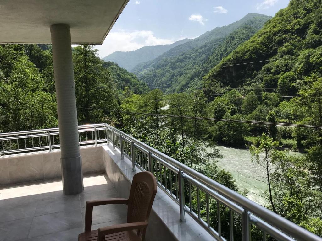 a balcony with a view of a river and mountains at Su Apart in Rize
