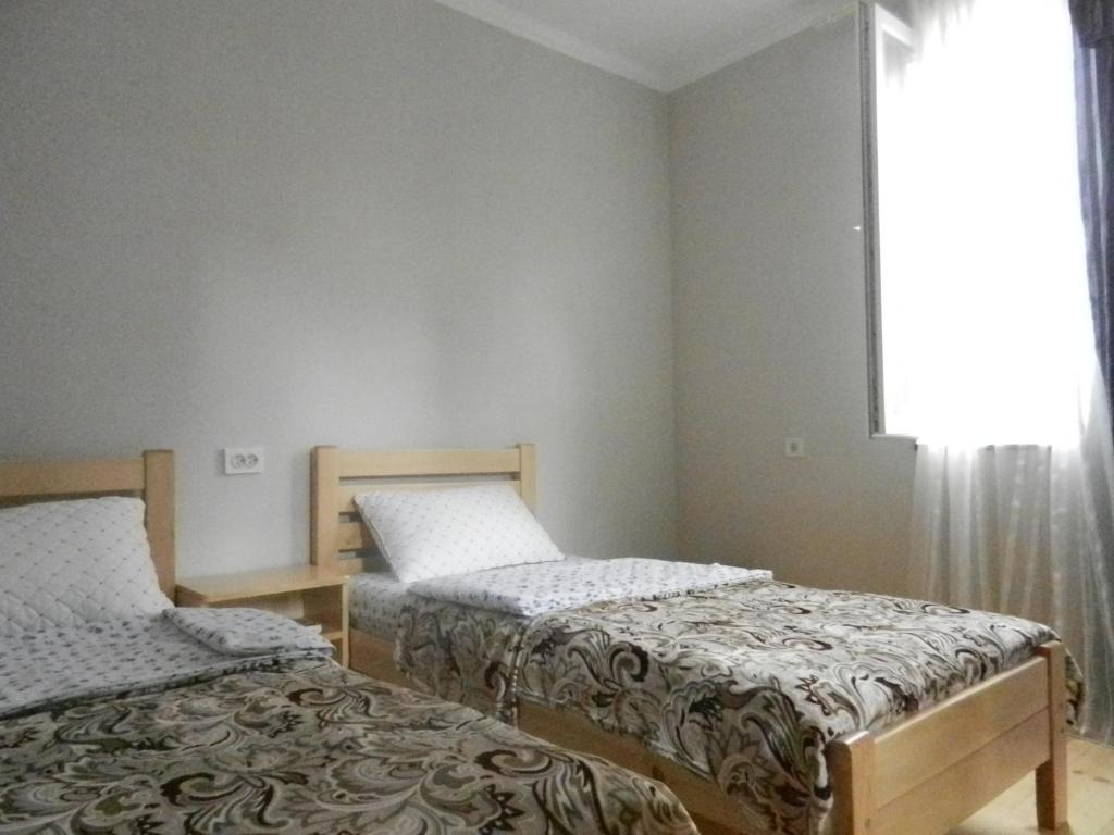 Postel nebo postele na pokoji v ubytování guest house katia tbilisi