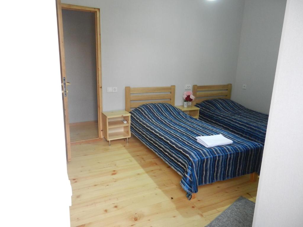 Postel nebo postele na pokoji v ubytování guest house katia tbilisi