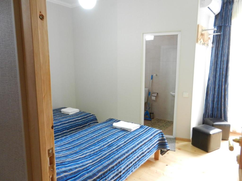 Postel nebo postele na pokoji v ubytování guest house katia tbilisi