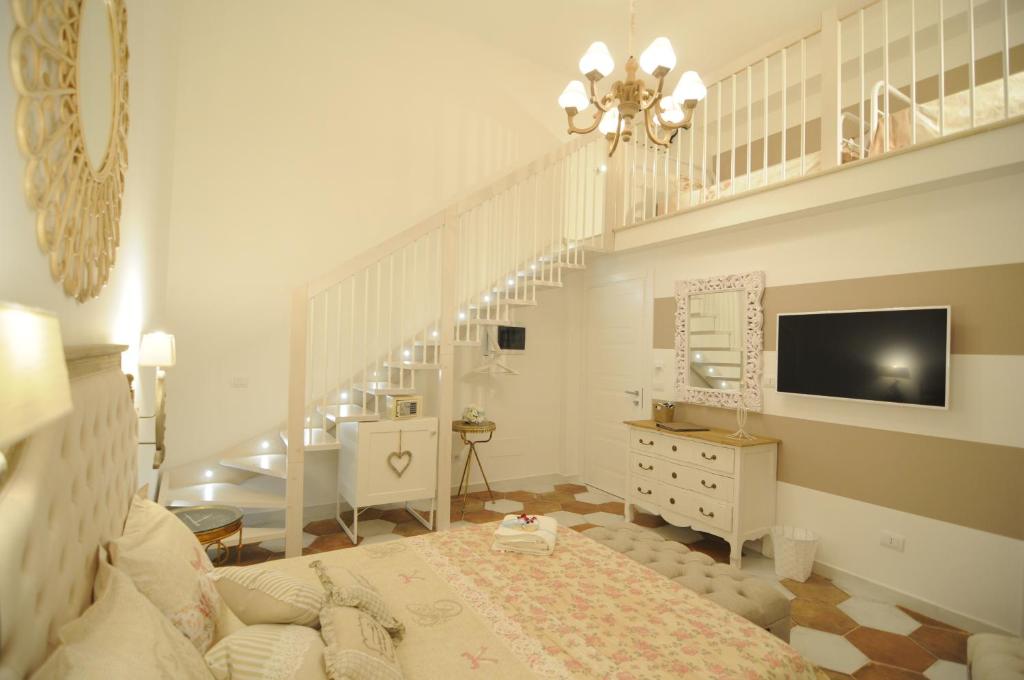 TV a/nebo společenská místnost v ubytování QuattroCuori Boutique Hotel & Spa