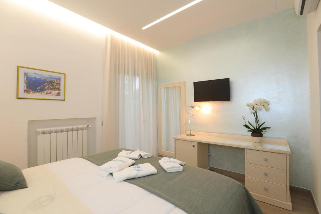 Łóżko lub łóżka w pokoju w obiekcie Relais Ohana - De Vivo Realty