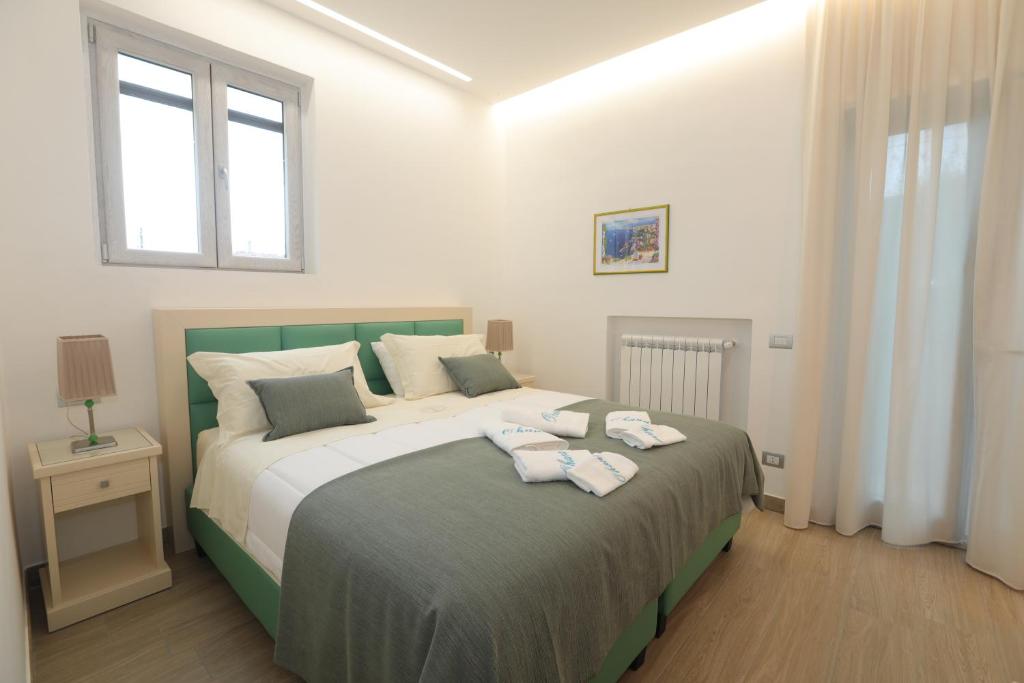Łóżko lub łóżka w pokoju w obiekcie Relais Ohana - De Vivo Realty