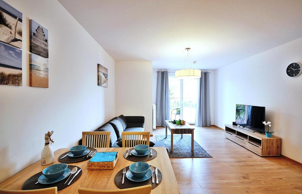 Televízia a/alebo spoločenská miestnosť v ubytovaní Apartament Lazur Polanki Park