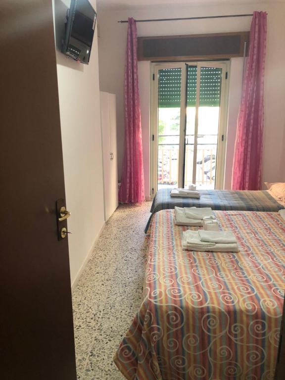 Cama ou camas em um quarto em B&B Crotone