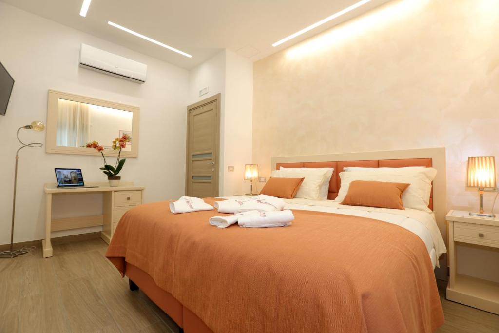 Łóżko lub łóżka w pokoju w obiekcie Relais Ohana - De Vivo Realty