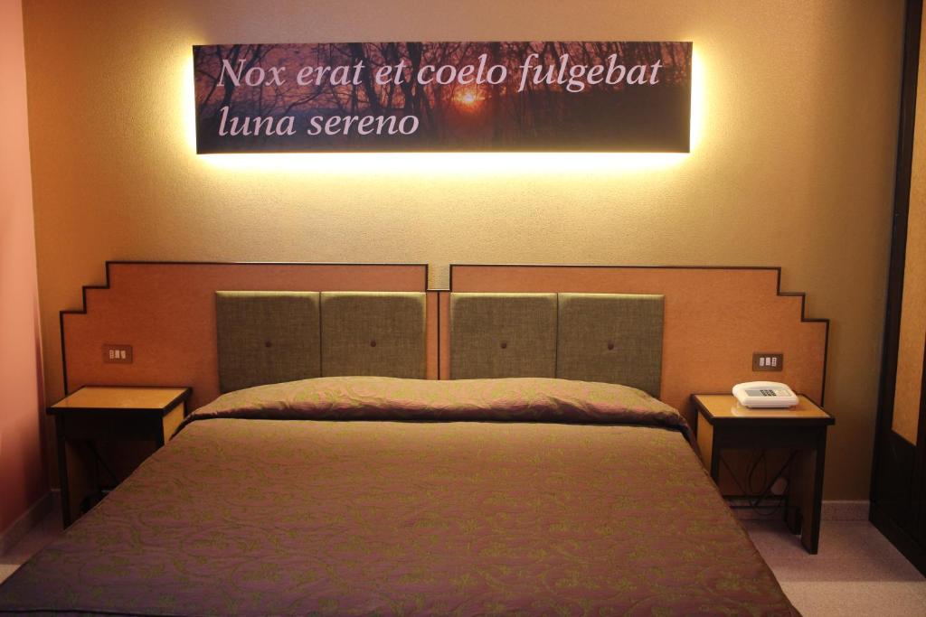 Postel nebo postele na pokoji v ubytování Hotel Orazio