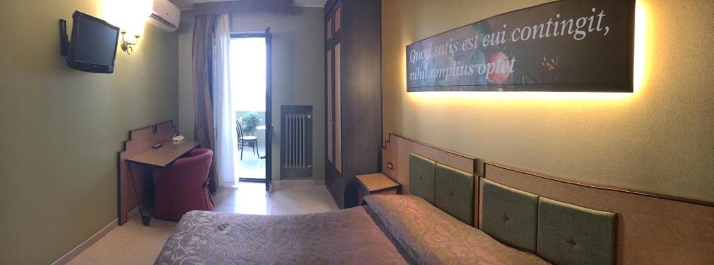 TV a/nebo společenská místnost v ubytování Hotel Orazio