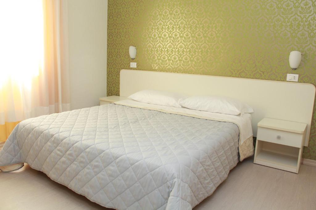 Llit o llits en una habitació de Hotel Stella Polare
