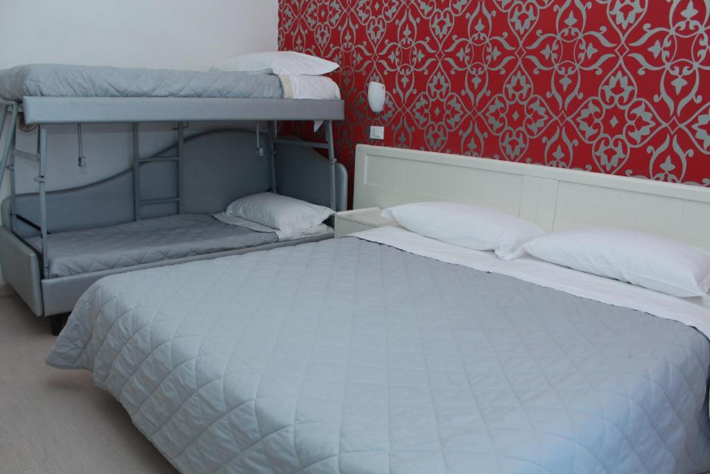 Llit o llits en una habitació de Hotel Stella Polare