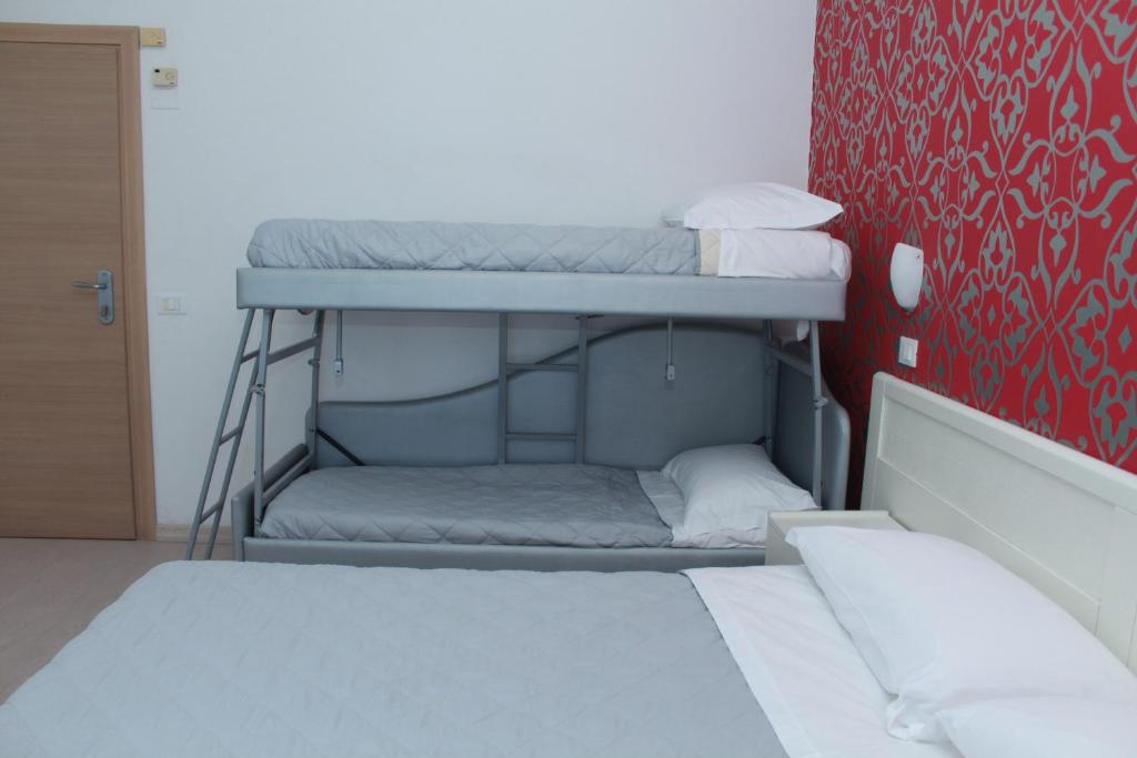 Llit o llits en una habitació de Hotel Stella Polare