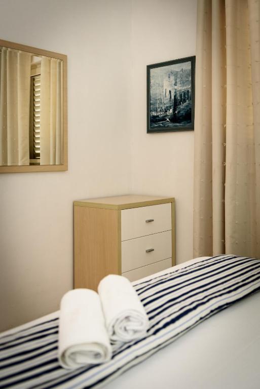 Posteľ alebo postele v izbe v ubytovaní Apartments Kudelik