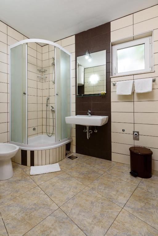 Kúpeľňa v ubytovaní Apartments Kudelik