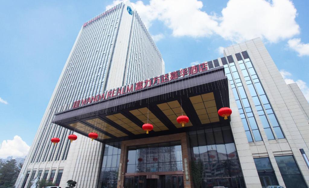 a tall building with red lanterns on top of it at Wanda Realm Ningde in Ningde