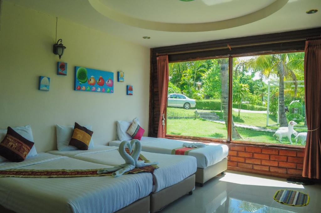 Postel nebo postele na pokoji v ubytování Pai Iyara Resort