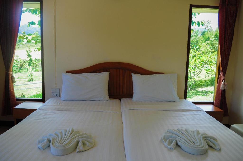 Postel nebo postele na pokoji v ubytování Pai Iyara Resort