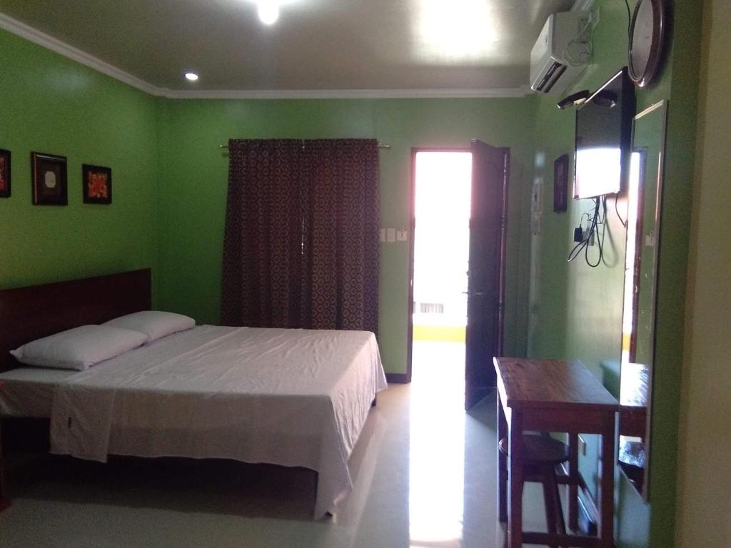 Postel nebo postele na pokoji v ubytování Golden Pension House,Palawan