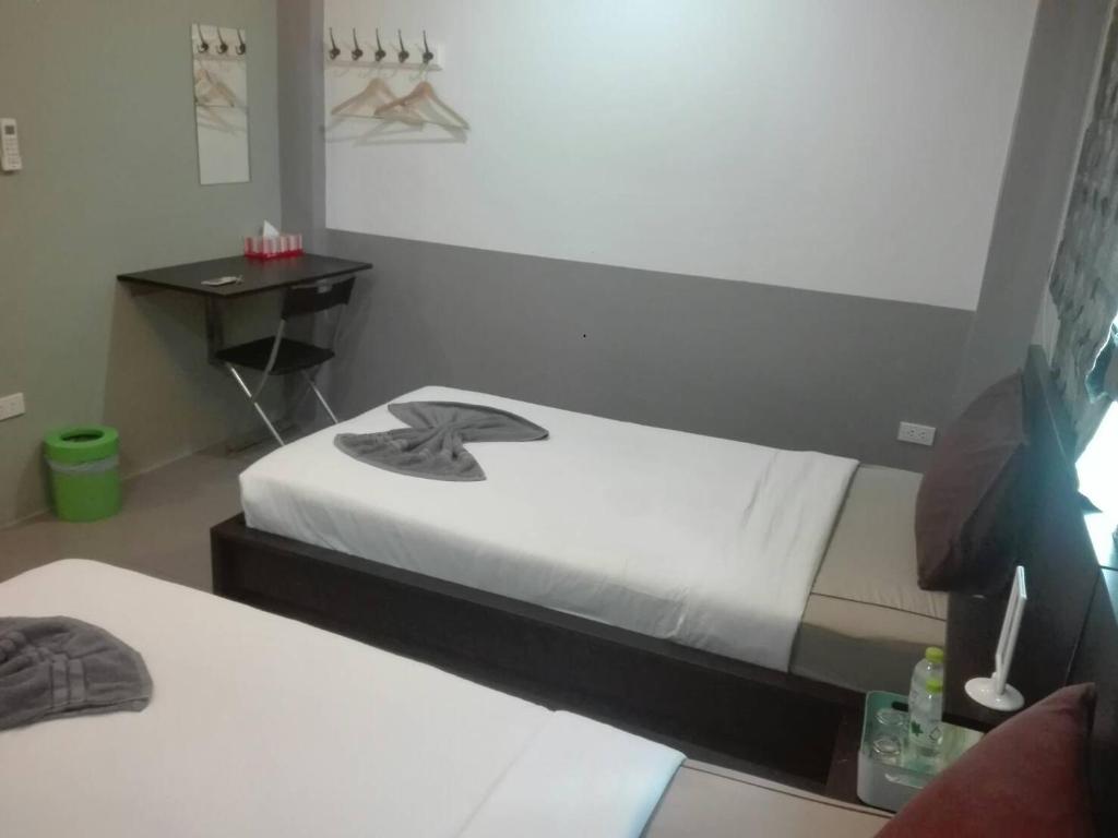 Postel nebo postele na pokoji v ubytování White Monkey Guesthouse