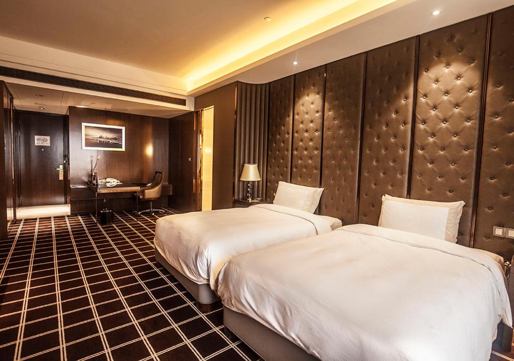 Postel nebo postele na pokoji v ubytování Royal Century Hotel Shanghai
