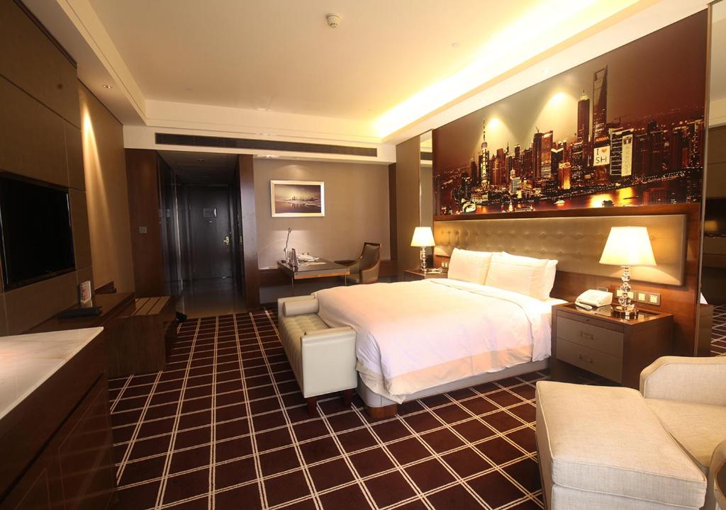 Postel nebo postele na pokoji v ubytování Royal Century Hotel Shanghai