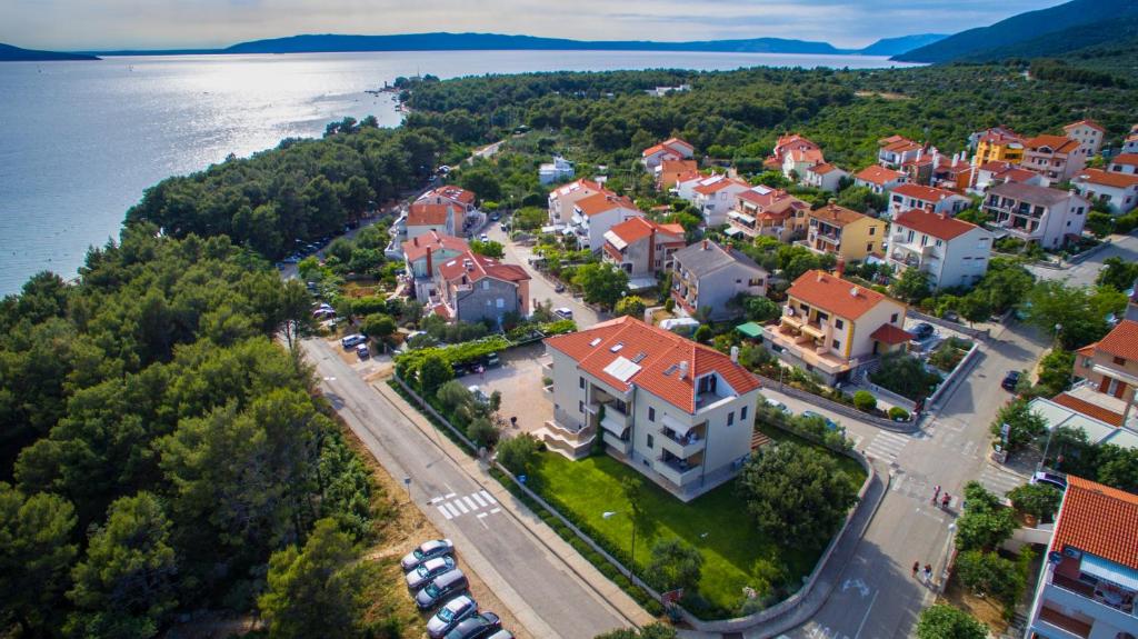 an aerial view of a town next to the water at CREPSA apartments in Cres