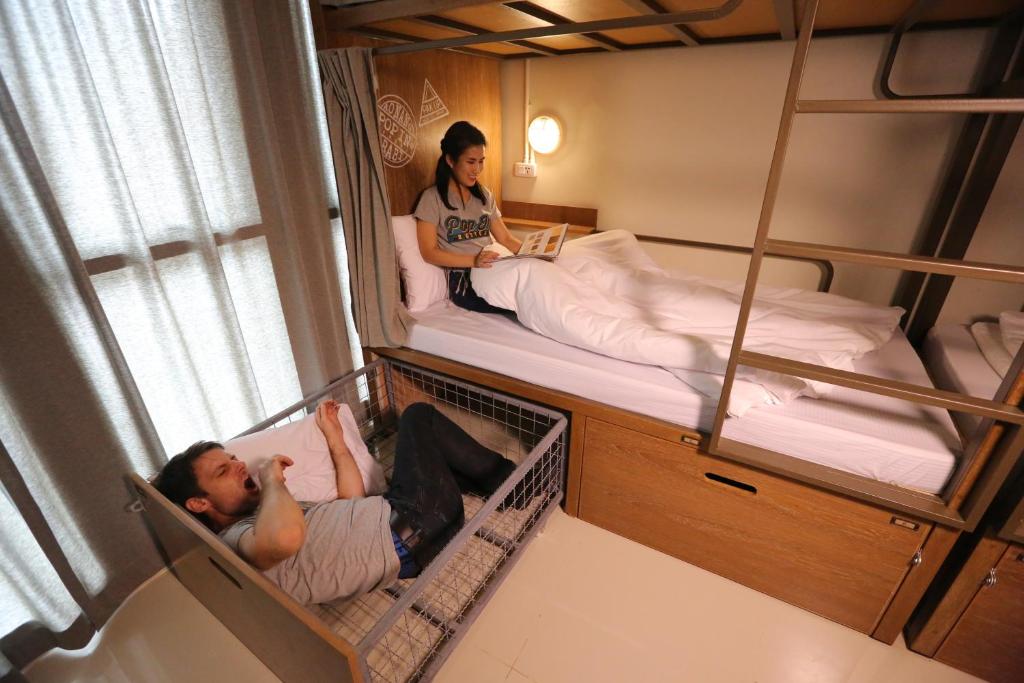 Postel nebo postele na pokoji v ubytování Pop-In Aonang