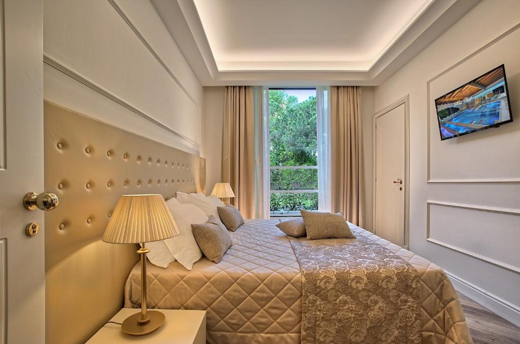 Postel nebo postele na pokoji v ubytování Hotel Eliseo Terme