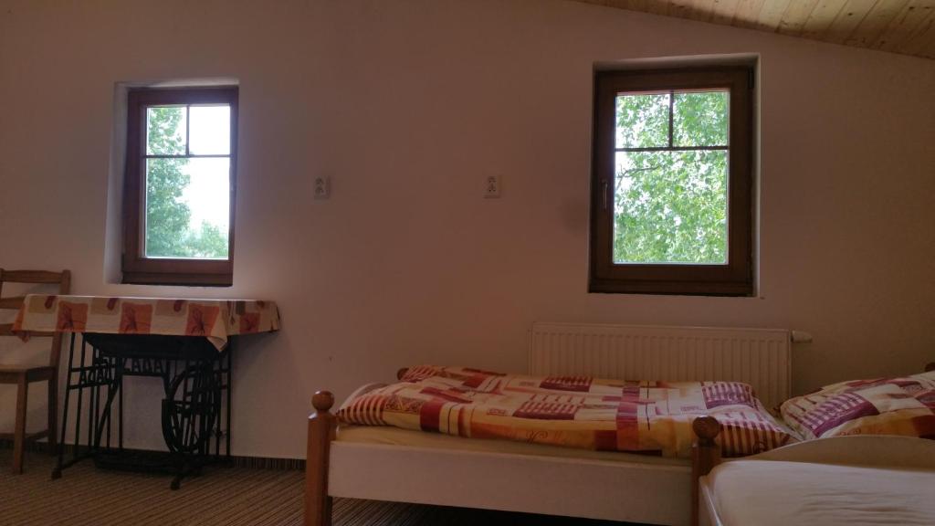 Postel nebo postele na pokoji v ubytování Penzion Filoun