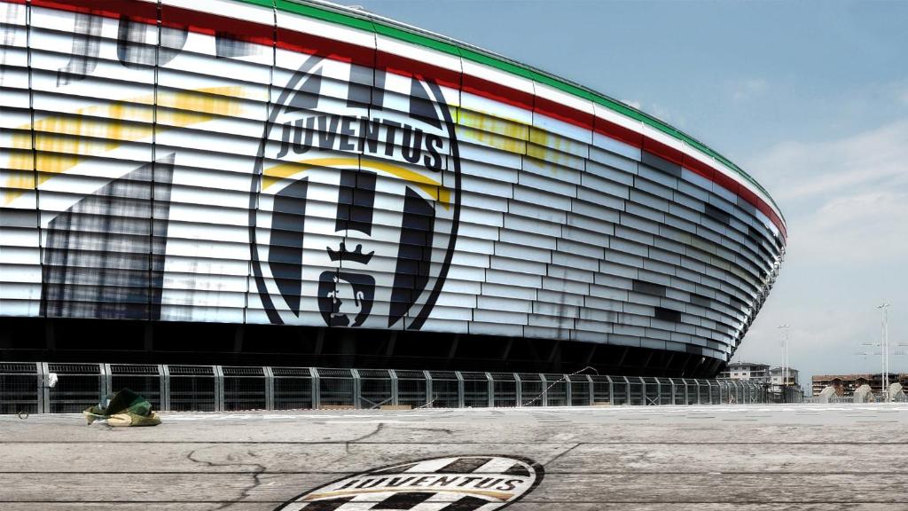 a building with a painting on the side of it at Juventus Stadium - piano primo in Turin