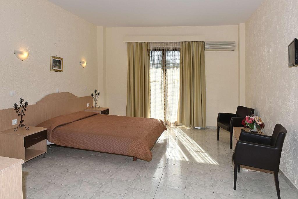 Postel nebo postele na pokoji v ubytování Santa Helena Hotel