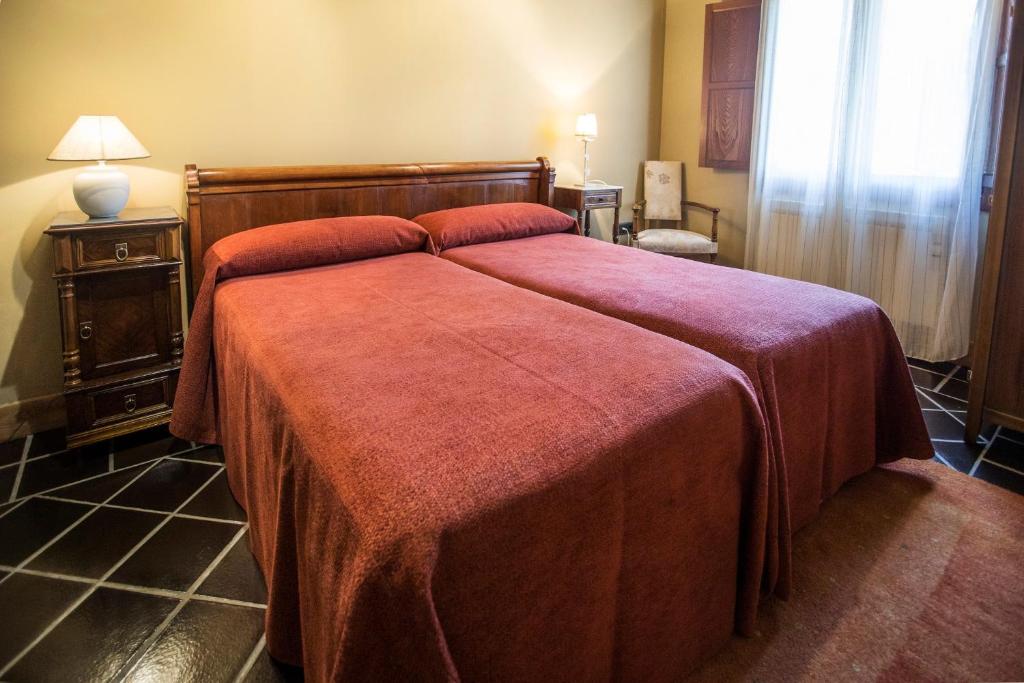 A bed or beds in a room at Buga II
