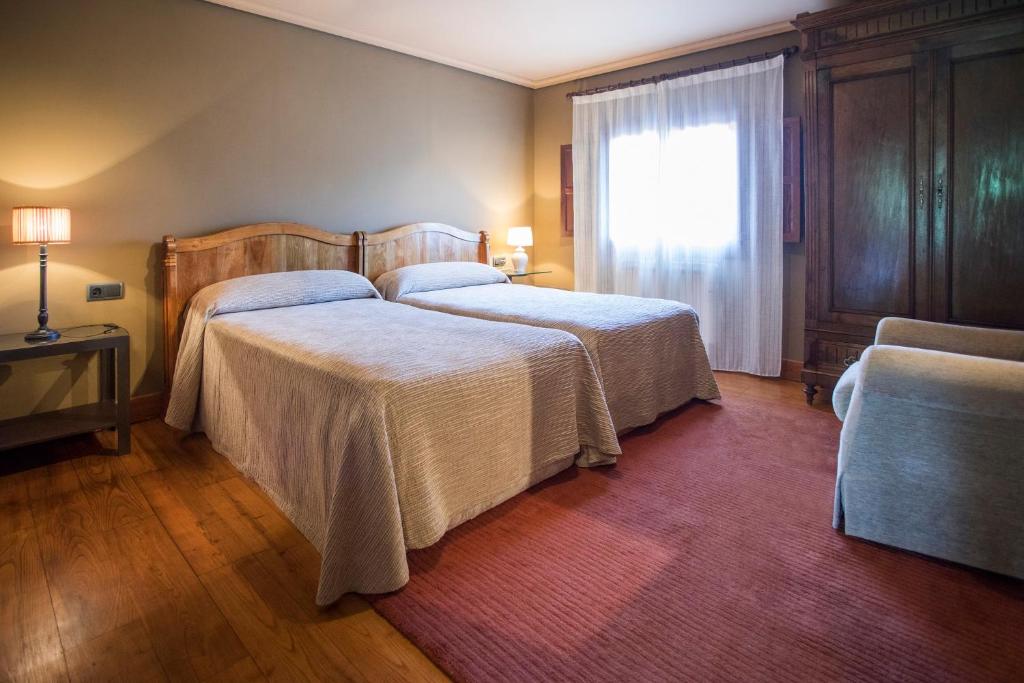 A bed or beds in a room at Buga II