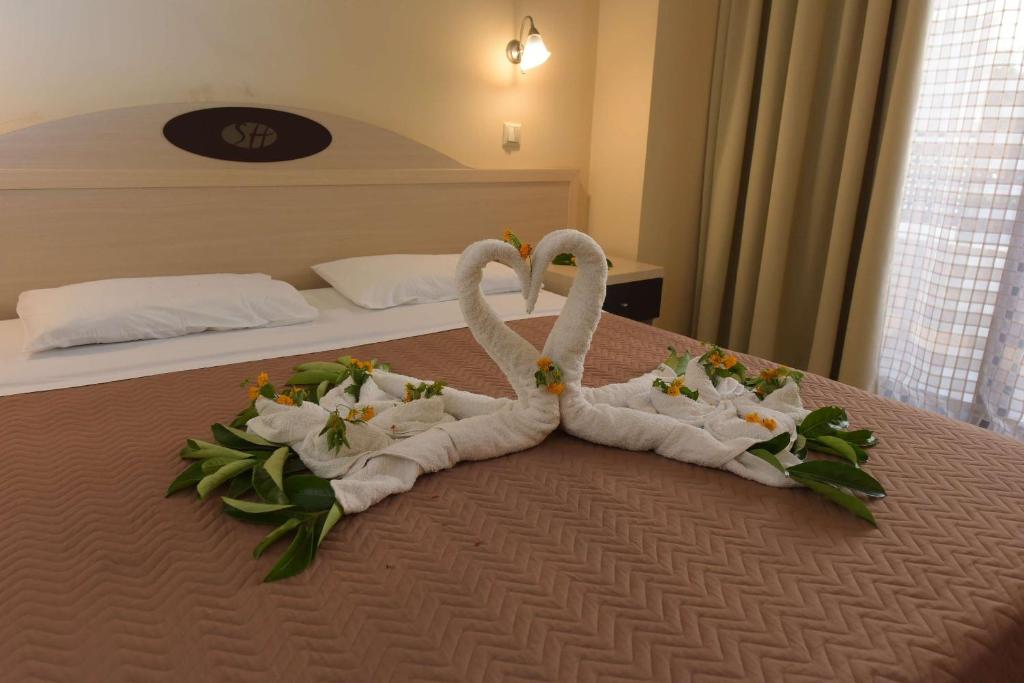 Postel nebo postele na pokoji v ubytování Santa Helena Hotel