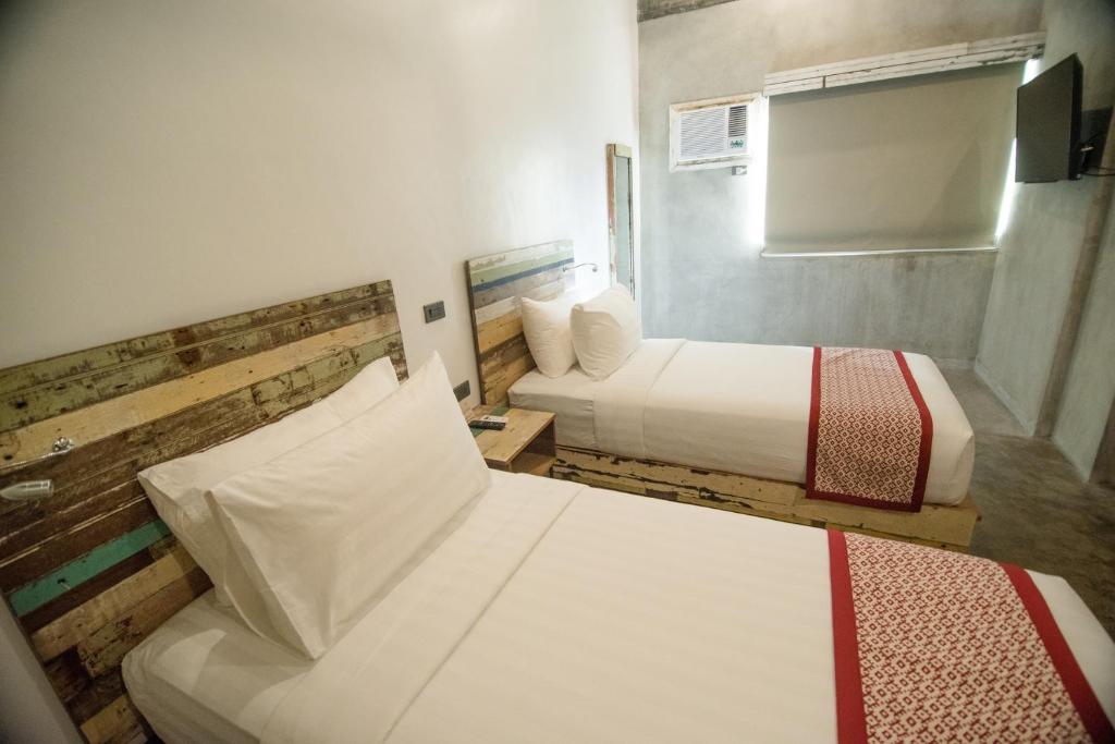 Postel nebo postele na pokoji v ubytování The Bricks Hotel