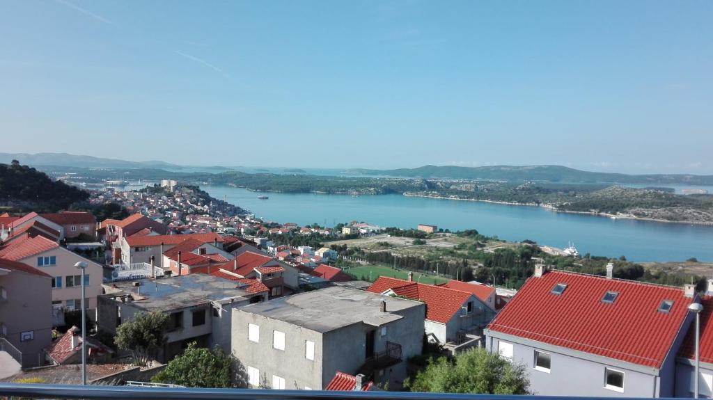 a view of a town with a river and buildings at Apartments Sky in Šibenik