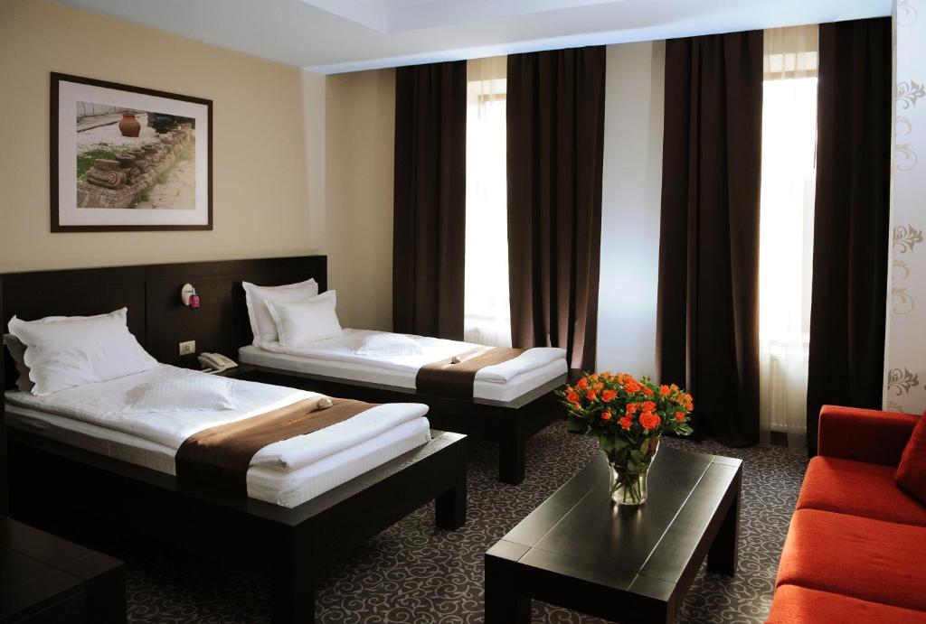 Postel nebo postele na pokoji v ubytování Hotel Cherica