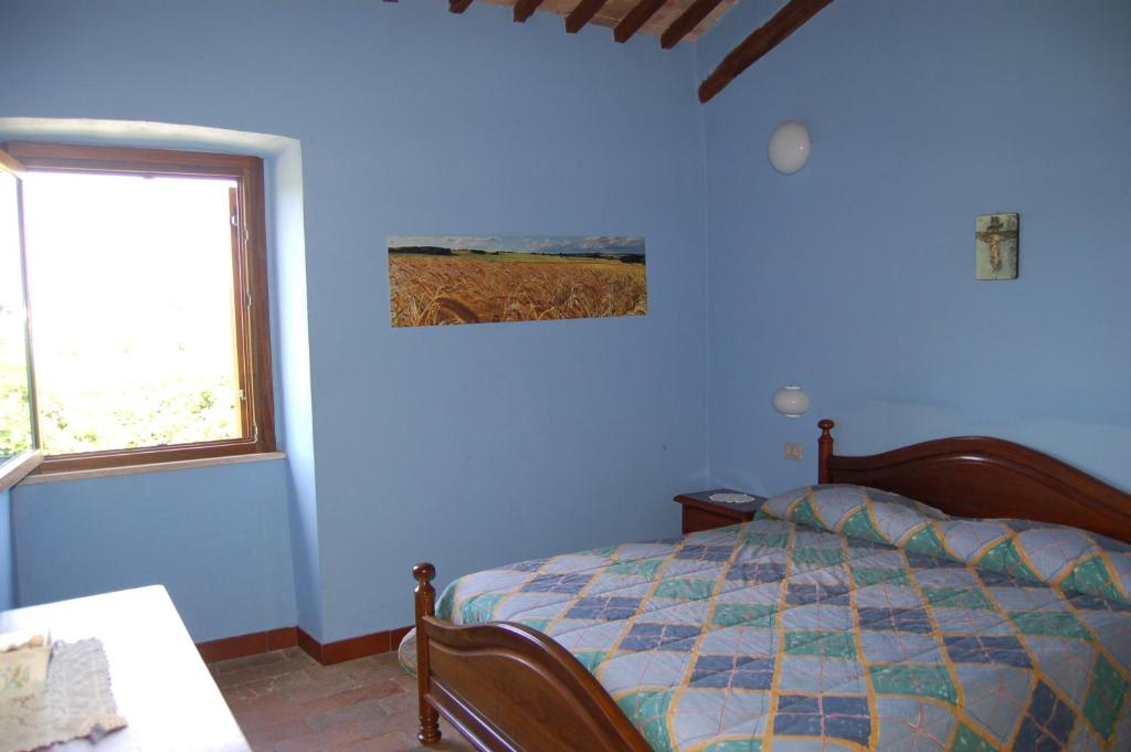 A bed or beds in a room at Agriturismo Castro