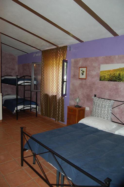 A bed or beds in a room at Agriturismo Castro