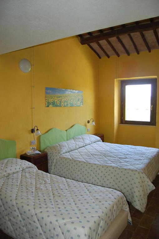 A bed or beds in a room at Agriturismo Castro