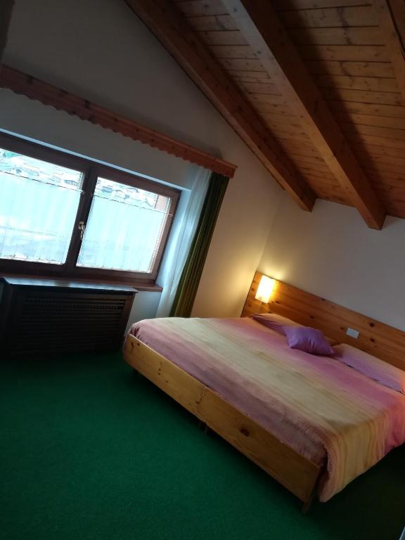 Postel nebo postele na pokoji v ubytování Albergo Krissin