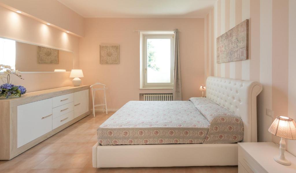 Łóżko lub łóżka w pokoju w obiekcie Relais Villa Belvedere & SPA ONLY ADULTS