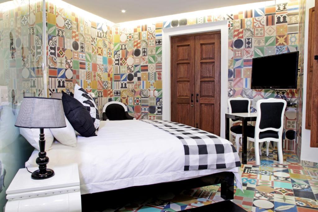 Postel nebo postele na pokoji v ubytování Del Carmen Concept Hotel Boutique by Chai