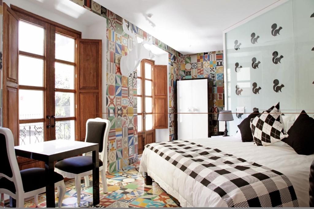 Postel nebo postele na pokoji v ubytování Del Carmen Concept Hotel Boutique by Chai