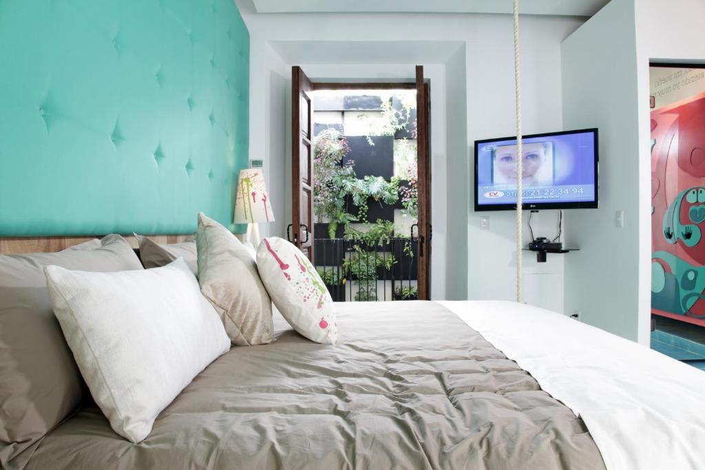 Postel nebo postele na pokoji v ubytování Del Carmen Concept Hotel Boutique by Chai