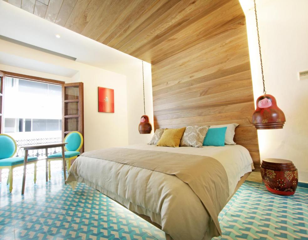 Postel nebo postele na pokoji v ubytování Del Carmen Concept Hotel Boutique by Chai