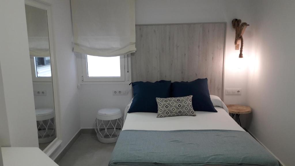 Postel nebo postele na pokoji v ubytování Hostal Cervantes Playa
