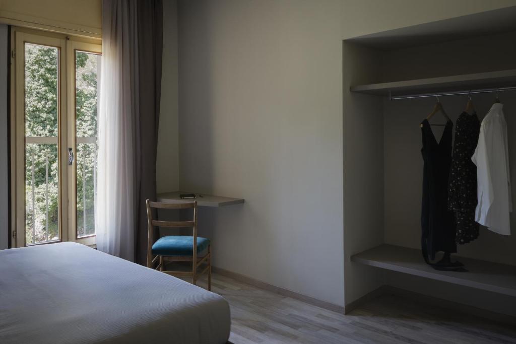 Postel nebo postele na pokoji v ubytování Hotel Beatrice